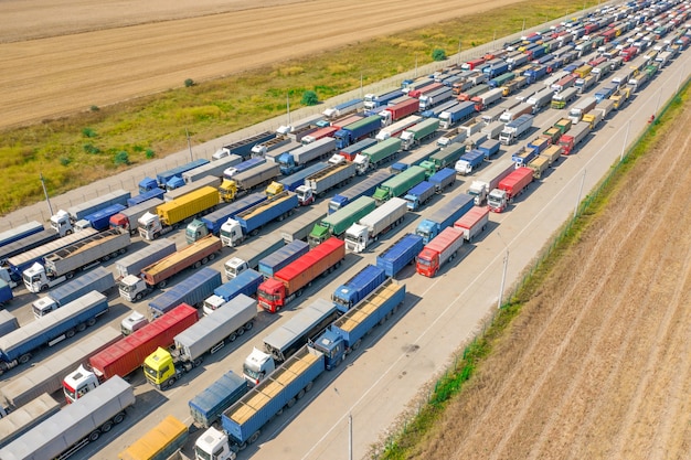 Trucks in line at the loading terminal. Transportation of goods by cars.