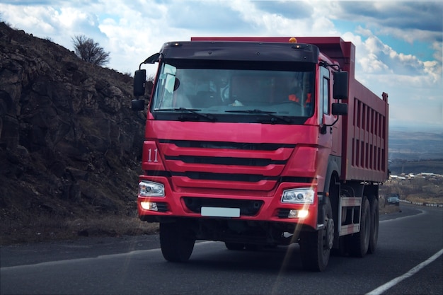 Trucks riding along road