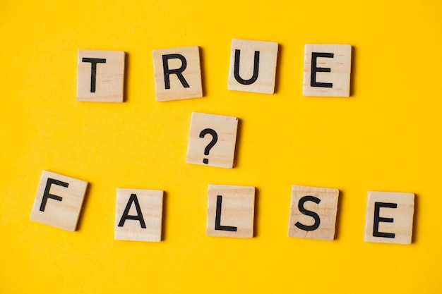 True or false words on a yellow background with a question mark Choice concept