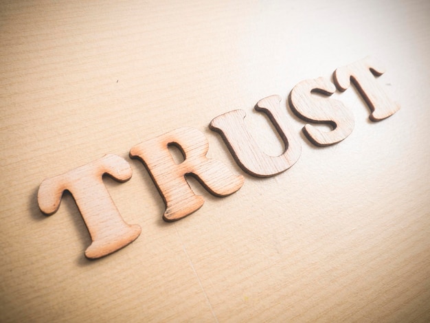 Trust business motivational inspirational quotes wooden words typography lettering concept