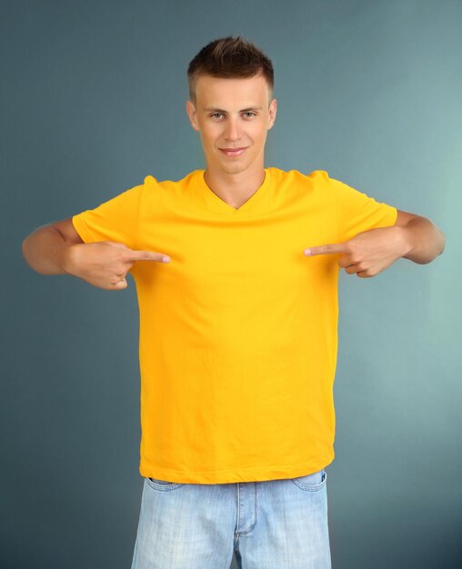 Tshirt on young man on grey background