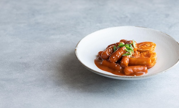 Tteokbokki rice stick in spicy sauce traditional korean cuisine selective focus copy space