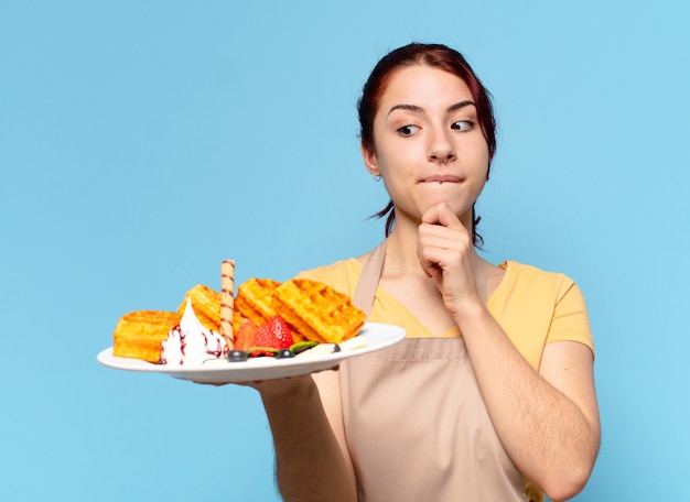 Tty bakkerij medewerker vrouw met wafels en gebak