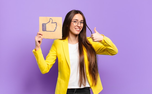 Tty businesswoman holding a social media like symbol