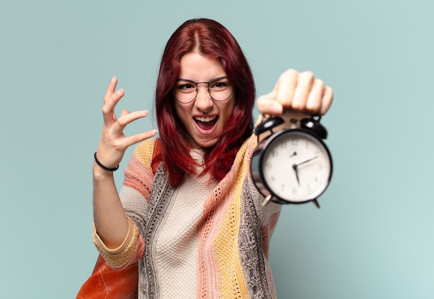 Tty student woman with an alarm clock