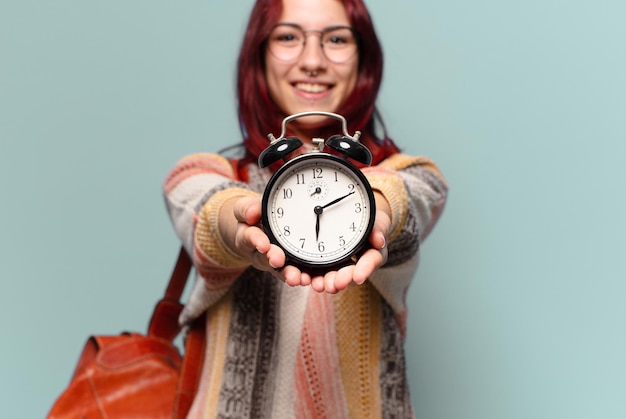 Tty student woman with an alarm clock