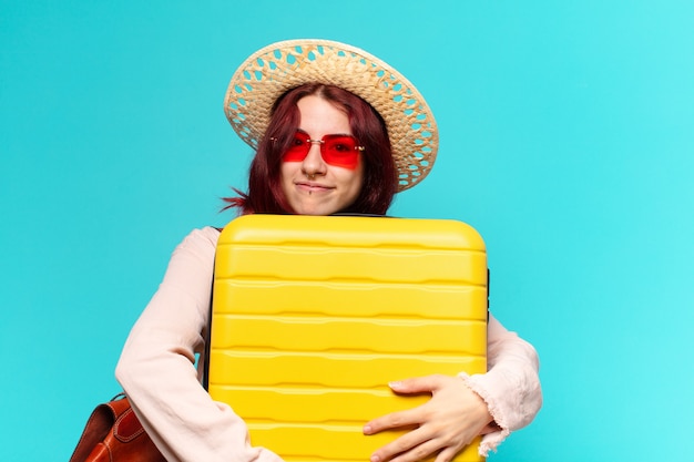 Tty woman on holidays with a suitcase