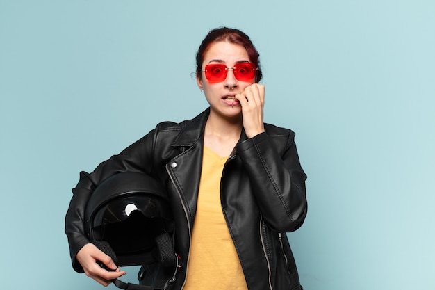 Tty woman motorbike rider with a safety helmet