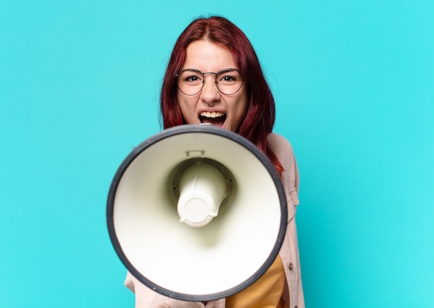 Tty woman shouting with a megaphone