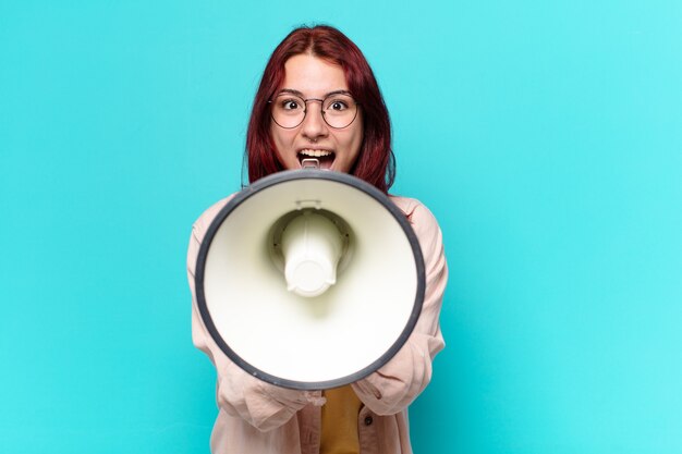 Tty woman shouting with a megaphone