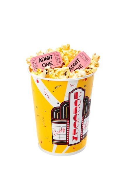 A tub of popcorn with movie tickets on top