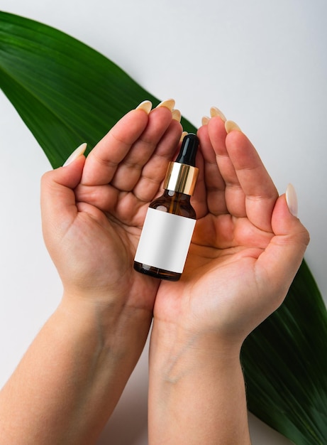 Tube in the hands of a girl on a white background