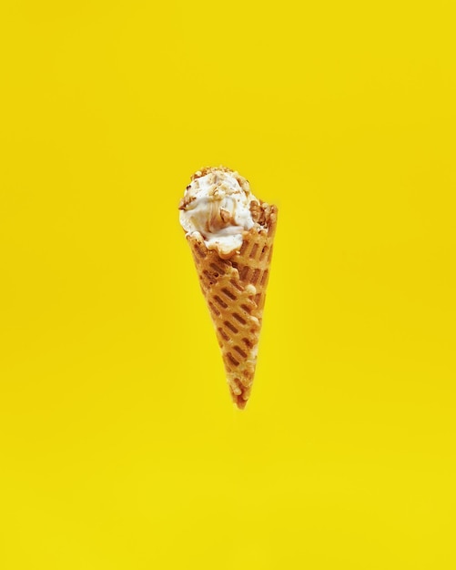 tube with ice cream on a yellow background