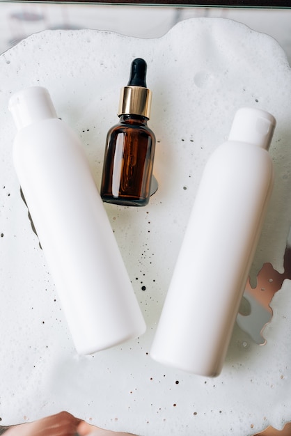 Photo tubes of cosmetics on white foam.