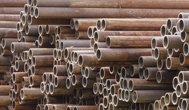 Tubes stacked in an industrial area