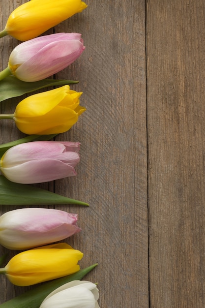 Tulip flowers on wood