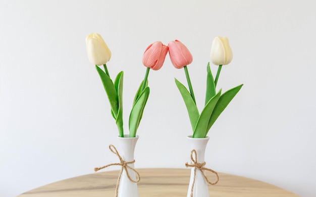 Tulips flowers in a white vase