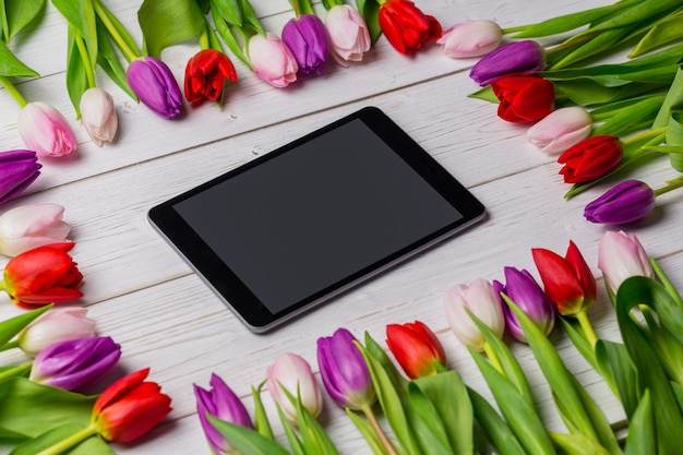 Tulips forming frame around tablet 