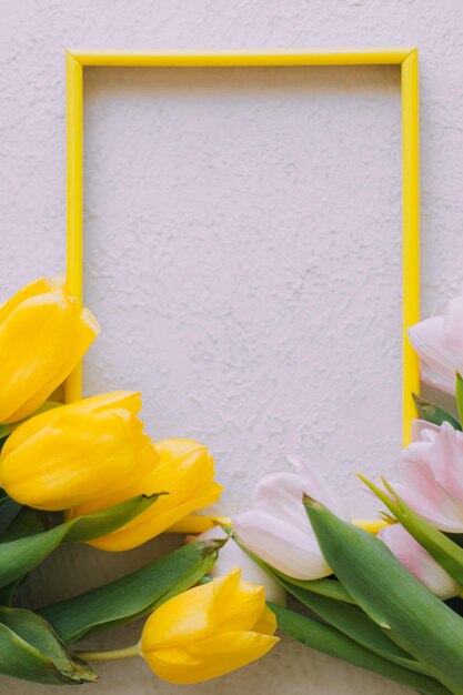 Tulips and a frame on a gray background Tulips of copy space Gray background