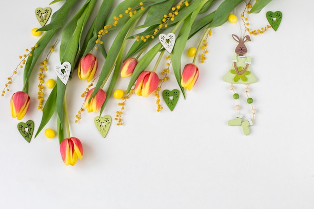 tulips, hearts and a rabbit made of wood 