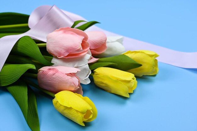 Tulips and Ribbons on blue background