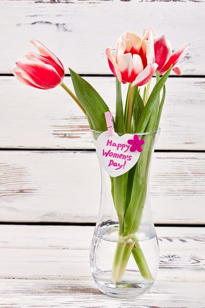 Tulips in transparent vase Simple flowers for woman