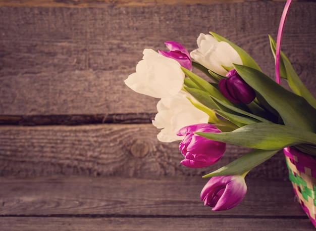 Tulips on wooden background