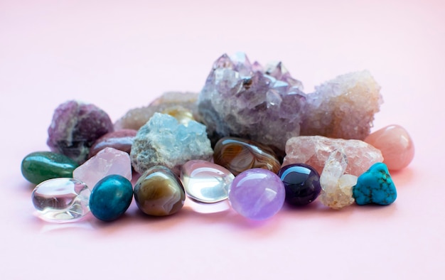 Tumbled and rough gemstones and crystals of various colors