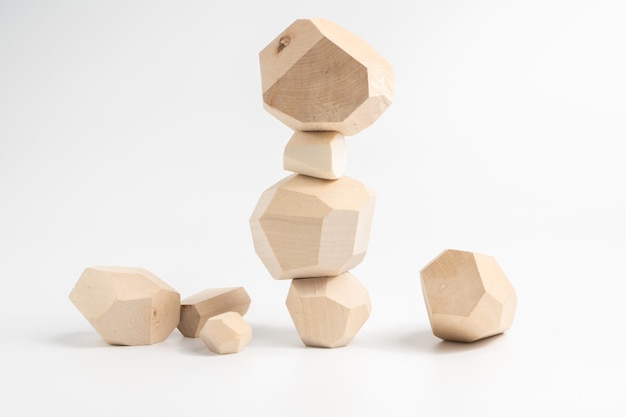 Tumi-ishi puzzle game. Construction of an unstable wooden block tower.