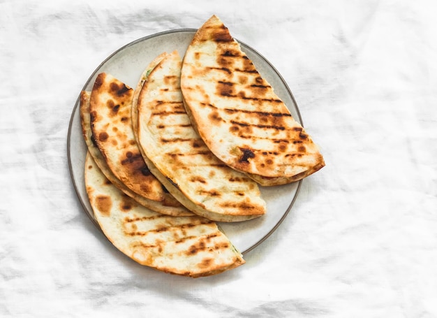 Tuna quesadilla vegetables on a on a light background top view