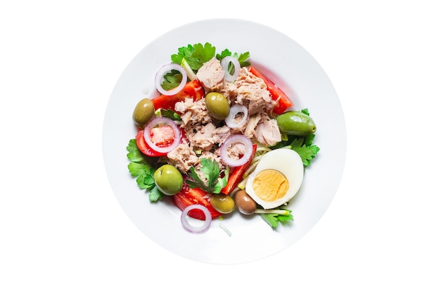 Tuna salad vegetable seafood tomato olives canned tuna fish plate on the table healthy meal