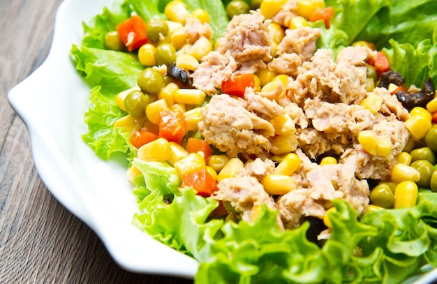 Tuna salad with mais on white shell dish