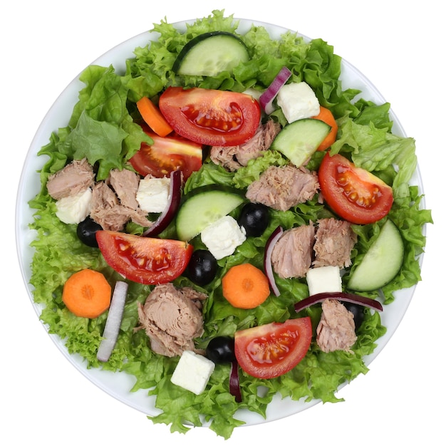 Tuna salad with tomatoes and olives in bowl from above