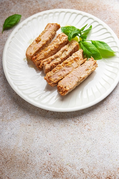 Tuna slice fish canned in oil seafood healthy meal food snack\
on the table copy space food