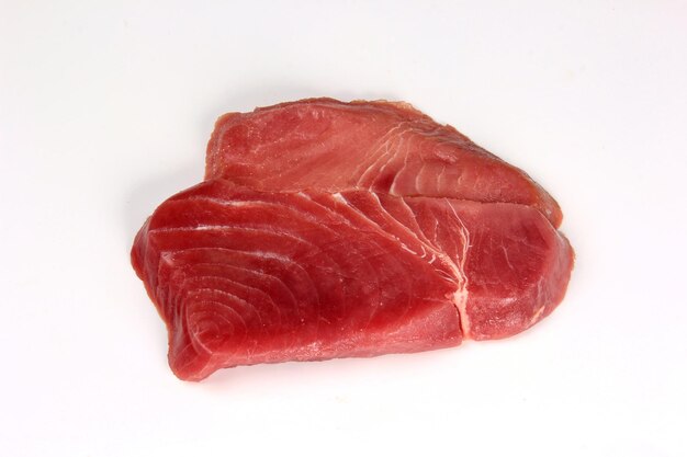 Tuna steak slice on a white background. fish steak