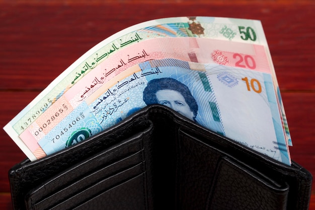 Tunisian money dinar in the black wallet