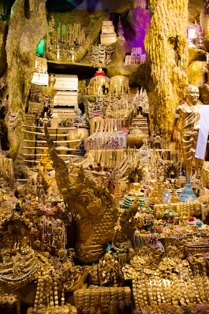 Tunnel naka cave underground and treasure for thai people travel visit respect praying blessing holy worship mystical ancient naga statue at Wat Maniwong or Mani Wong temple in Nakhon Nayok Thailand