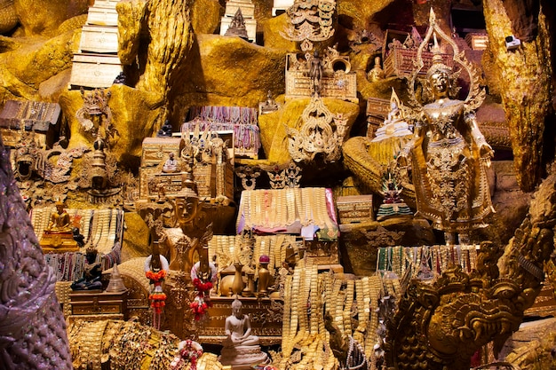 Tunnel naka cave underground and treasure for thai people travel visit respect praying blessing holy worship mystical ancient naga statue at Wat Maniwong or Mani Wong temple in Nakhon Nayok Thailand