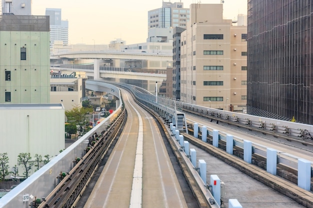 Tunnel railroad of elevated Yurikamome monorail train to Odaiba direction in Tokyo, Japan.