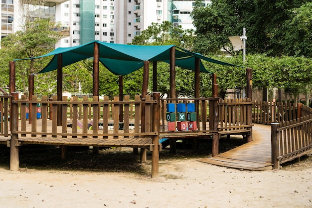 Tunnel and slider rustic and colorful playground for children in the park children's corner Recreation area