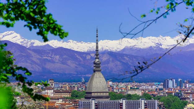 Turin, Torino, aerial timelapse skyline panorama with Mole Antonelliana, Monte dei Cappuccini and the Alps in the background. Italy, Piemonte, Turin.