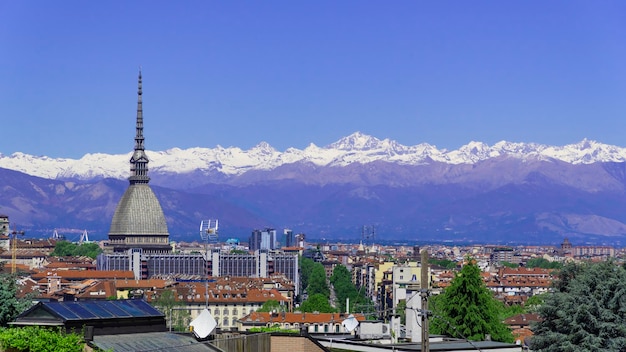 Turin, Torino, aerial timelapse skyline panorama with Mole Antonelliana, Monte dei Cappuccini and the Alps in the background. Italy, Piemonte, Turin.