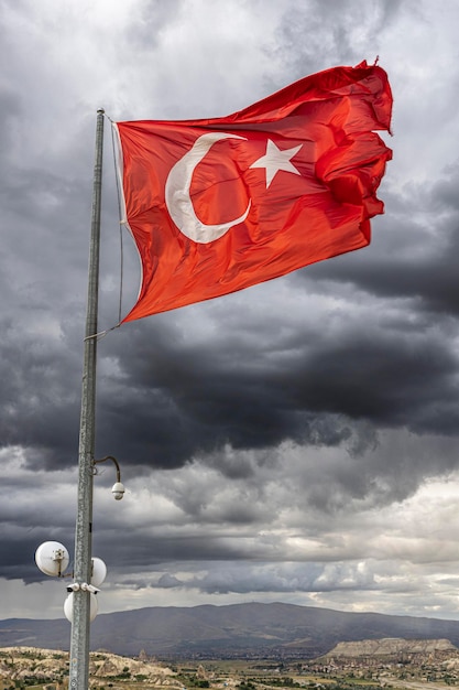 Turkey flag flying over the city of goreme