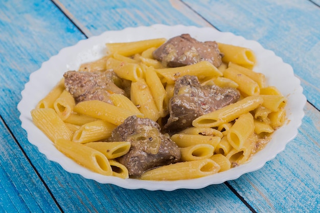 Turkey liver with pasta on a plate