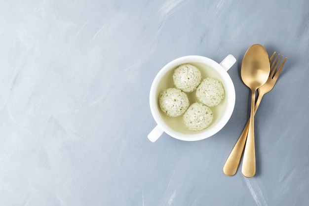 Turkey meatballs with spinach in bone broth. Dietary product with natural collagen.