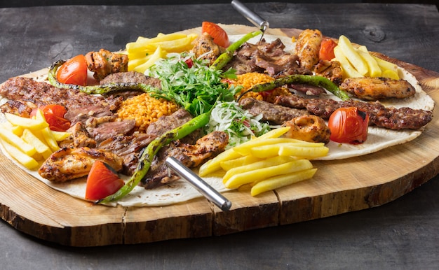 Turkish adana kebab with vegetables on the plate