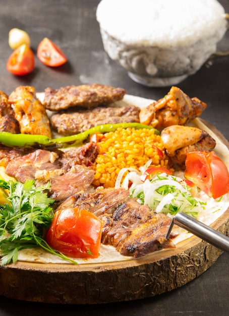 Turkish adana kebab with vegetables on the plate