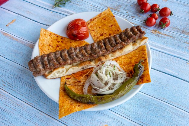 Turkish Adana Kebab with Vegetables on the Plate