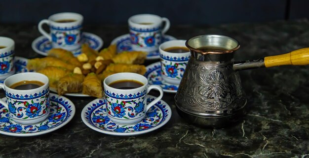 Turkish baklava and coffee on the table Selective focus