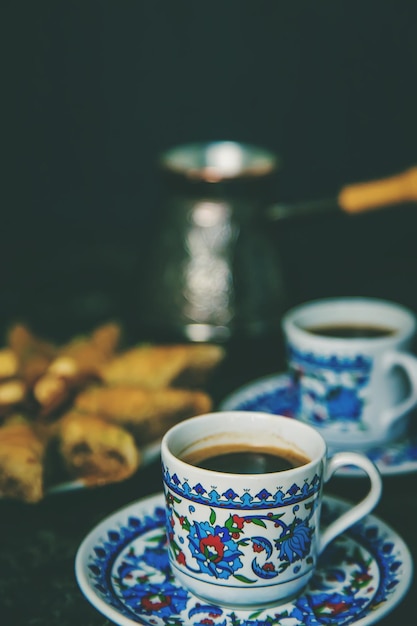 Turkish baklava and coffee on the table Selective focus